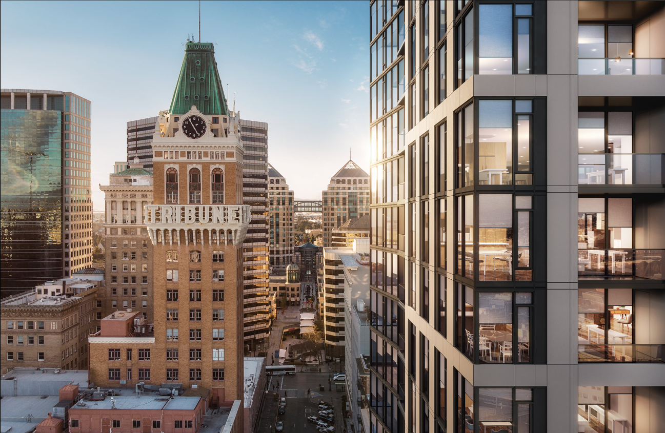 Downtown Oakland skyline with the Tribune Tower and a modern apartment building